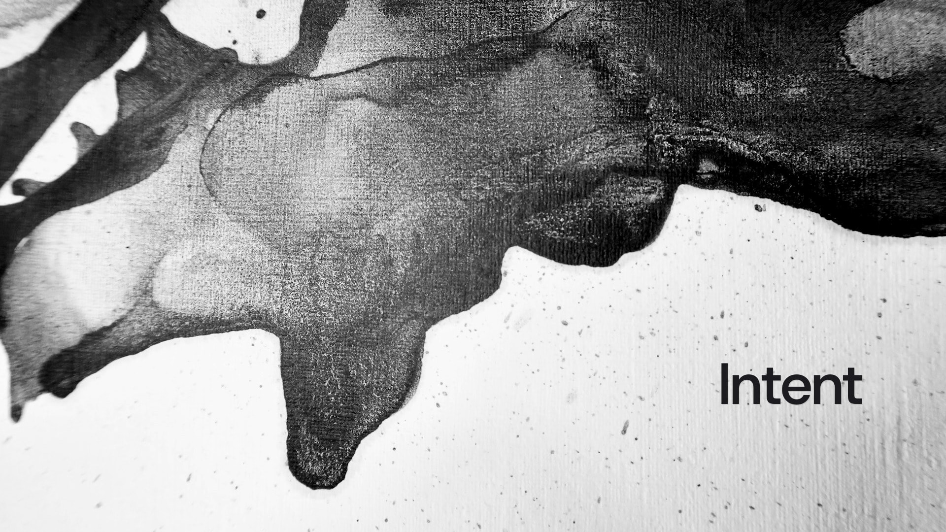 Intent, set on empty paper next to an ink blot.